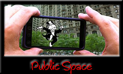 Link button for the Public Space posts on iRez. Image on button is of John Craig Freeman's augmented reality artwork "American Plutocracy" where a "Money Man" from the game "Monopoly" is augmented reality superimposed, via an iPhone, over buildings in the New York City financial district.
