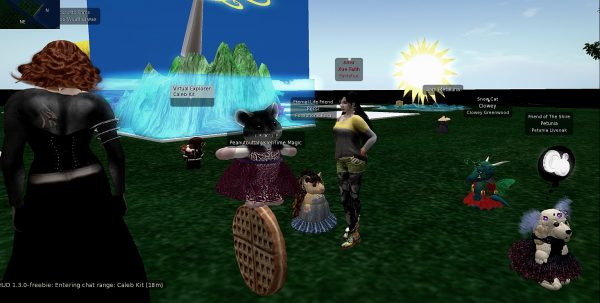 a half dozen or more avatars standing around in a grassy clearing after the "Haiku Speedbuild" event on the Heron Shire sim in Second Life
