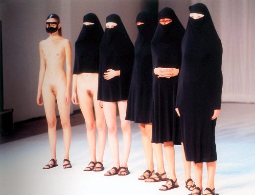 image of 6 women wearing elements of Hussein Chalayan's "Burka" from 1996. The first wear a full Burka, the last is naked except for a small face mask, and the other 4 are in in-between states of dress and undress