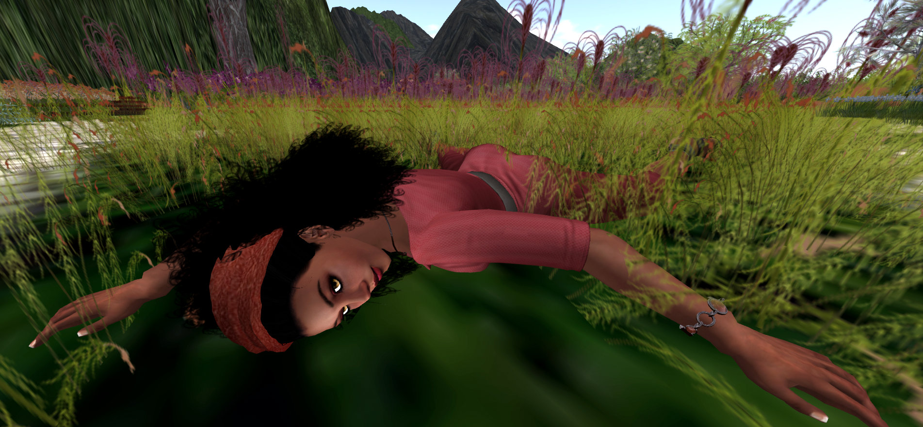 image of Vaneeesa Blaylock laying in field of flowers.