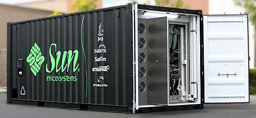 A cargo container with Sun logos on the outside and the door open to show the server farm inside