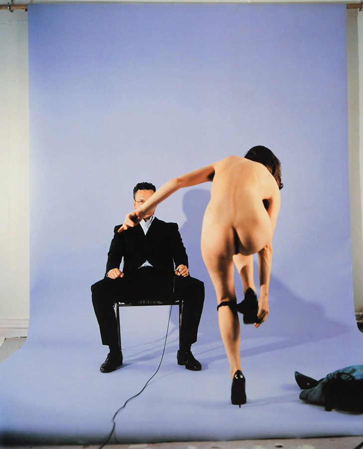 Vaneeesa Blaylock, The Hague, 1997, back to camera, doing formalized striptease in front of male faculty member