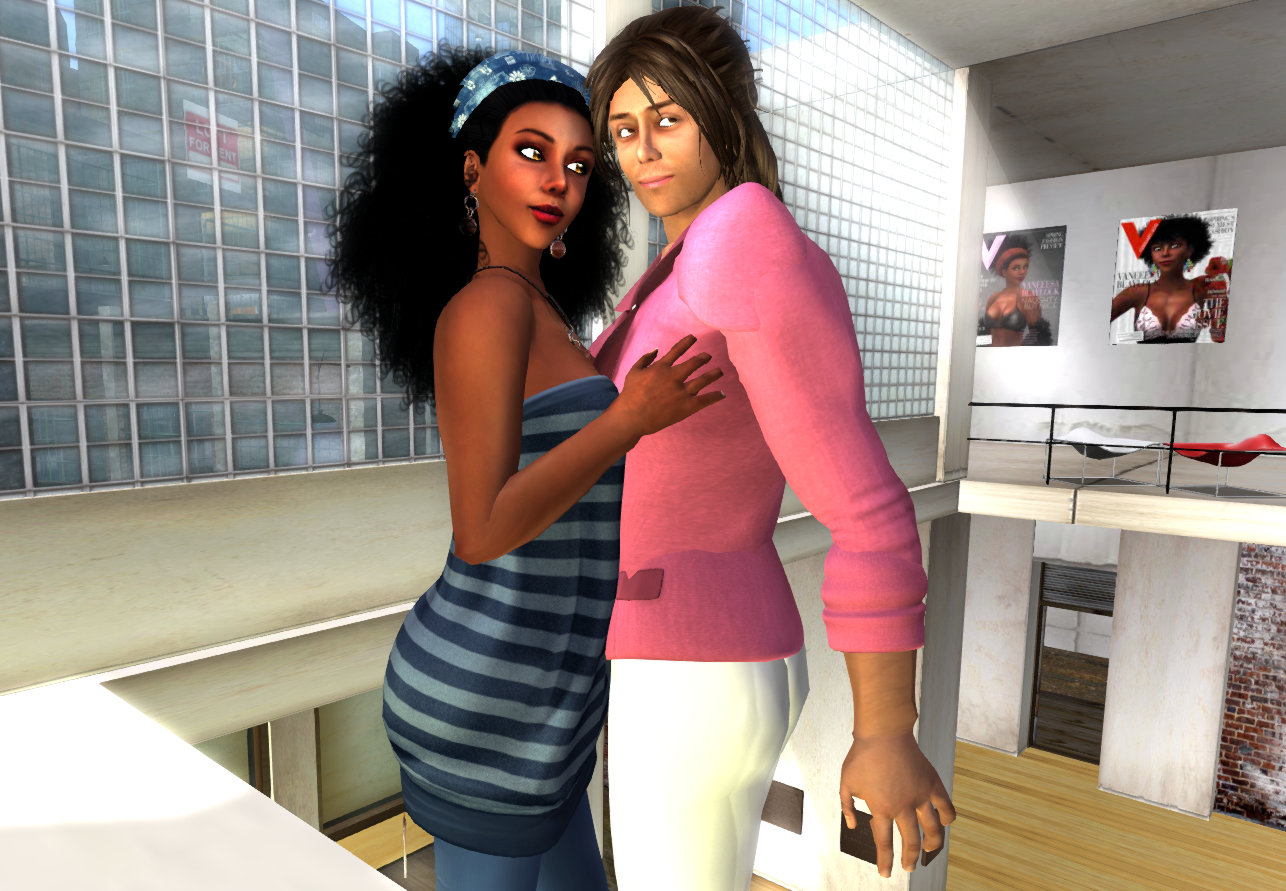 Vaneeesa Blaylock in a blue dress and Mark Zackerly in a a pink blazer