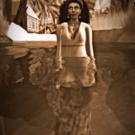 Sepia-toned photograph of Vaneeesa Blaylock waist-deep in water with tropical islands in the background