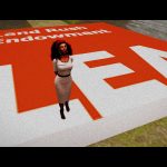 Vaneeesa Blaylock stands on a giant red square with the writing "Land Rush Endowment LEA" on it.