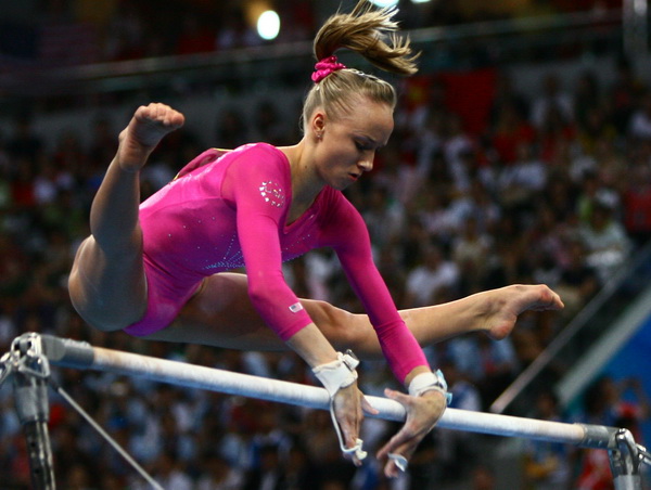 Image of Nastia Liukin on uneven parallel bars at 2008 Olympic Games in Beijing
