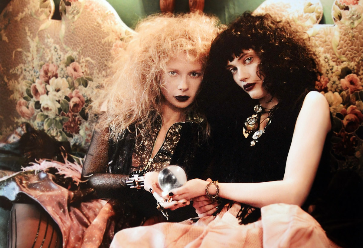 Fiona Blaylock & Vaneeesa Blaylock in Port-au-Prince, Haiti in 1994 in the lobby of "Blaylock's Palmistry" they both have highly teased hair and are holding a crystal ball in their hands