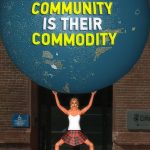 Photo of Botgirl Questi holding an enormous globe over head with the text on it, "Our Community is their commodity"